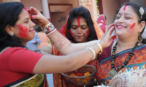 Women playing with vermillion powder (Sindoor Khela) on the last day of the Durga Puja festival in Chandigarh
