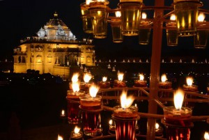 Akshardham temple is illuminated with some 10,000 Diyas or oil-lit lamps on the eve of Diwali in Gandhinagar on November 10, 2015. Lighting of the lamps started November 10 and will last until November 16