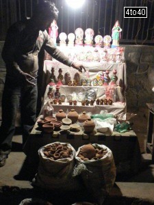 Earthen Lamps, statues of Goddess Laxmi and Lord Ganesha on sale during Diwali festive season