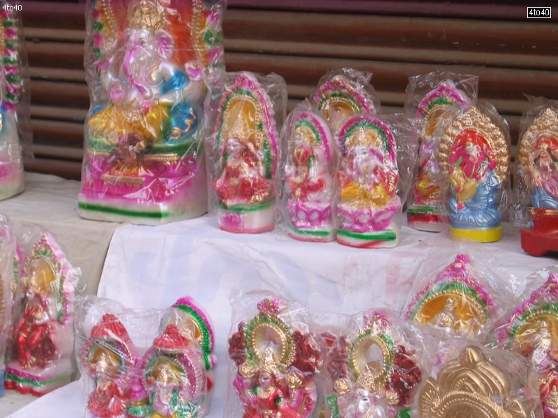 Goddess Lakshami and Lord Ganesha plaster of paris idols for sale at Nangloi Mode, New Delhi