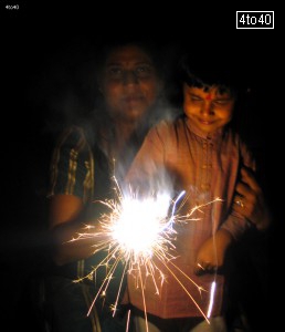 Harman Malik playing with Phuljhari on Diwali Festival at Cosy Apartment, Sector 9, Rohini, New Delhi