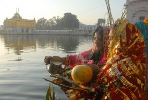 Hindu devotees offer prayers during Chhat Puja at Durgiana Temple in Amritsar on November 17, 2015