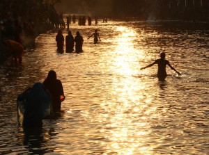 Hindu devotees offer prayers during Chhat Puja at Sirhind Canal in Bathinda on November 17, 2015