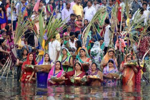 Hindu devotees offer prayers during Chhath Puja in Surat on November 17, 2015
