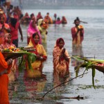 Hindu devotees offer prayers to the sun during the Chhath festival in Kolkata on November 17, 2015. Hindu devotees pay obeisance to both the rising and the setting sun in the Chhath festival when people express their thanks and seek the blessings of the forces of nature, mainly the sun and river