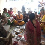 Hindu women performing Govardhan Puja at Cosy Apartments, Sector 9, Rohini, New Delhi