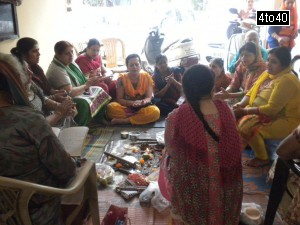 Hindu women performing Govardhan Puja at Cosy Apartments, Sector 9, Rohini, New Delhi