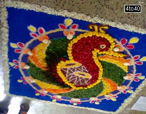 Housewives make rangoli at home entrance during Diwali celebrations