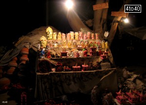 Roadside potter selling statues of Hindu Gods Earthen Lamps and pots near Rohini East Metro Station, Rohini, New Delhi
