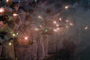 Widows hold sparkers and diyas -- oil lamps -- during Diwali celebrations at Kesi Ghat on the banks of the Yamuna river in Vrindavan on November 10, 2015