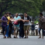 A man is rescued from his house in the flooded Kotturpuram area in Chennai on December 2, 2015.