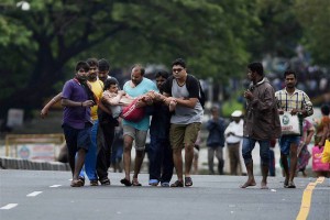 A man is rescued from his house in the flooded Kotturpuram area in Chennai on December 2, 2015.