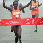 Cynthia Limo of the Women's elite category crosses the finishing line at the Airtel Delhi half Marathon 2015 in New Delhi on November 29, 2015. Limo took the first place in the category.