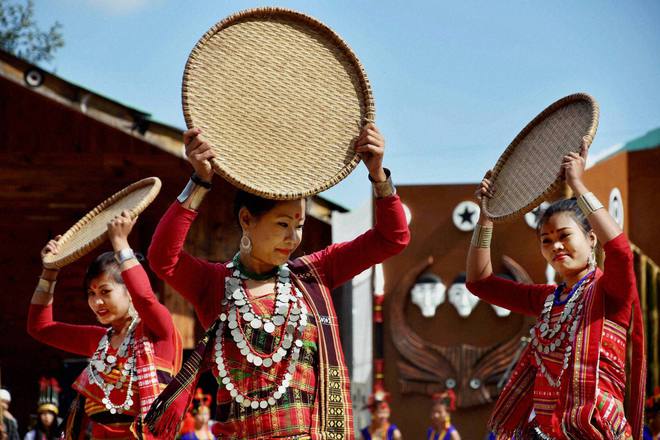 Dancers perform on the third day of the annual Hornbill Festival at Kisama, some 15 km from Kohima, Nagaland, on December 2, 2016.