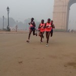 Delhi half marathon runners at 14KM mark at India Gate