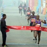 Ethiopia’s Birhanu Legese of Men's elite category crosses the finish line for at the Airtel Delhi Half Marathon 2015 in New Delhi on November 29, 2015. Legese took the first spot in the category.