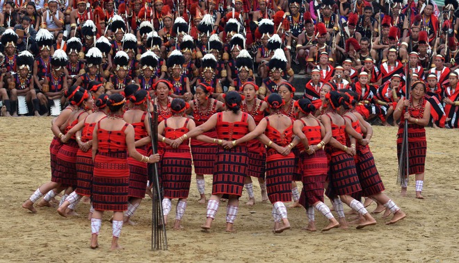 Naga Sangtam tribals perform a folk dance on the fourth day of the annual Hornbill Festival at Kisama, on the outskirts of Kohima on December 4, 2015.