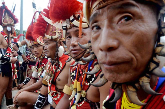 Naga tribals perform a folk dance on the fourth day of the annual Hornbill Festival at Kisama, on the outskirts of Kohima on December 1, 2015.