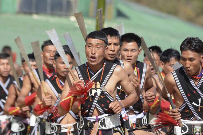 Naga tribesmen perform on the third day of the annual Hornbill Festival at Kisama, some 15 km from Kohima, Nagaland, on December 3, 2016.