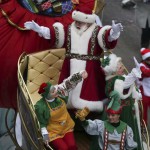 Santa Claus waves to fans as he goes down 6th Avenue during the 89th Macy's Thanksgiving Day Parade in the Manhattan borough of New York on November 26, 2015.