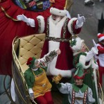 Santa Claus waves to fans as he goes down 6th Avenue during the 89th Macy's Thanksgiving Day Parade in the Manhattan borough of New York on November 26, 2015.