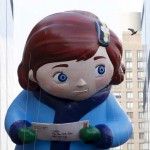 The Virginia balloon floats down Central Park South as a pigeon flies by during the 89th Macy's Thanksgiving Day Parade in the Manhattan borough of New York on November 26, 2015.