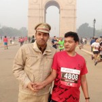 Tilak Marg SHO Sushil Daila encouraging Delhi Half Marathon participants at India Gate