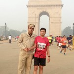 Tilak Mark Station Head officer Sushil Daila encouraging Delhi Marathon runners