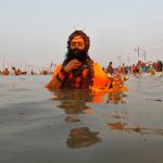 A Sadhu prays as he takes a dip at Sangam, a confluence of three rivers, the Ganga, the Yamuna and the mythical Saraswati, on the occasion of Makar Sankranti festival in Allahabad, on January 14, 2017