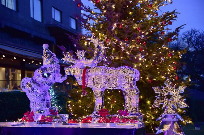 A Santa Claus and reindeer made by hotel chef and world ice carving champion Yoshihito Kosaka is displayed at a hotel in Tokyo on December 24, 2015. The 1.8-meter tall ice sculptures were carved from 2.5-ton ice blocks