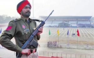 A cop Stands guard at the Guru Nanak Stadium the venue for the district level Republic Day function in Amritsar