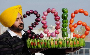 A local artist makes a model of 2016 using vegetables on eve of New Year in Amritsar