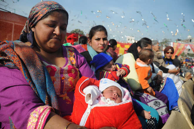 A mother with her child during the Lohri celebrations