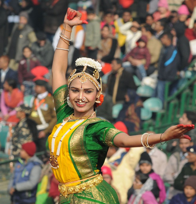 An artiste performing on Chhattisgarh tableau on the Rajpath during the full dress rehearsal for the Republic Day parade on January 23, 2016