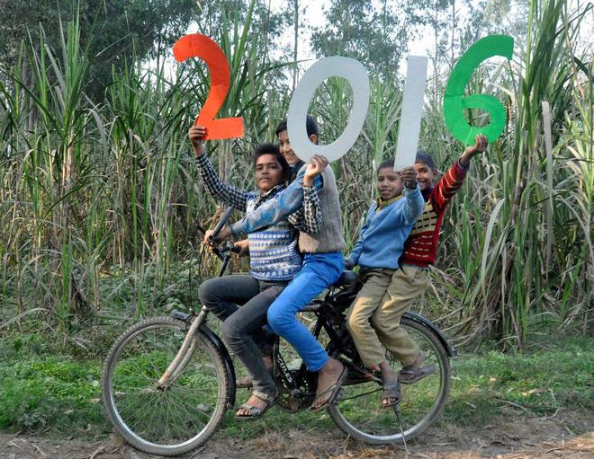 Children welcome New Year 2016 at a village in Moradabad