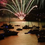 Fireworks explode over boats anchored on Sydney Harbour during a 9pm display before midnight fireworks usher in the new year in Australia's largest city, December 31, 2015
