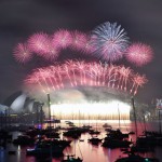 Fireworks light up the sky over Sydney's Opera House (L) and Harbour Bridge during New Year celebrations in Sydney on January 1, 2016
