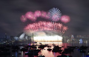 Fireworks light up the sky over Sydney's Opera House (L) and Harbour Bridge during New Year celebrations in Sydney on January 1, 2016