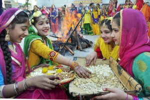 Girls dressed in traditional attire during the Lohri celebration at a school in Patiala, on January 13