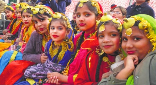Girls wait for their turn during Lohri Mela in Ludhiana