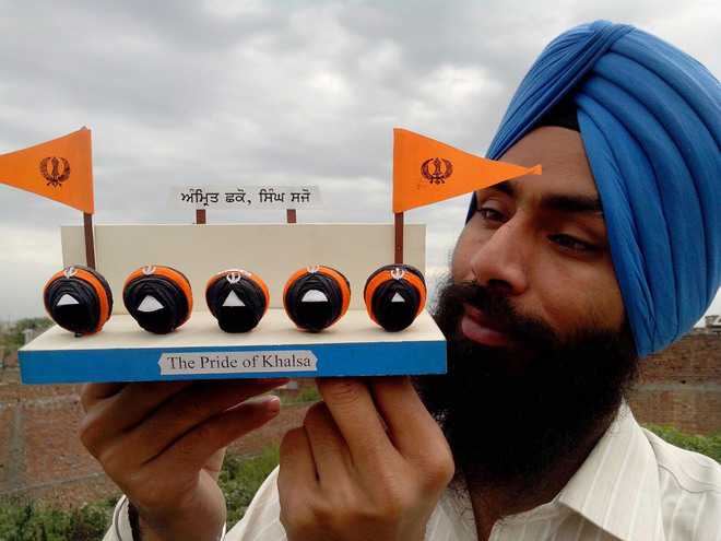 Gurpreet Singh with one of his paper creations in Amritsar