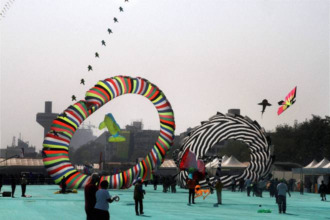 Participants fly kites during the International Kite festival in Ahmedabad on January 11, 2016