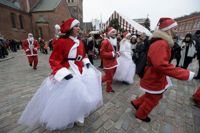 People dressed as Santa Claus participate in the Santa’s Fun Run charity event in Riga, Latvia, on December 11, 2016