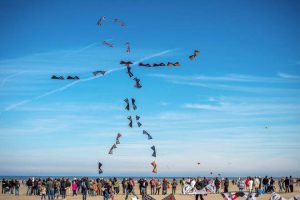 People fly kites during the 30th International Kite Festival in Berck-sur-Mer in northern France on April 12, 2016