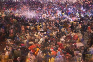 People spray artificial snow during Christmas eve celebrations in Hengyang, Hunan province, December 24, 2015