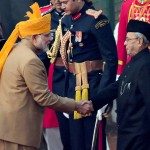 Prime Minister Narendra Modi greets President Pranab Mukherjee during the 67th Republic Day