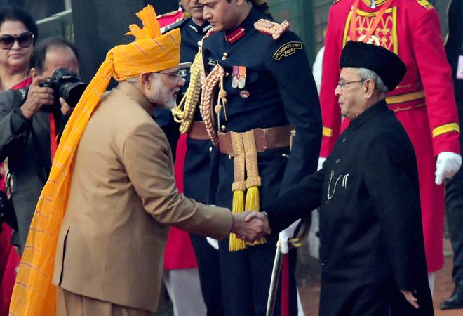 Prime Minister Narendra Modi greets President Pranab Mukherjee during the 67th Republic Day