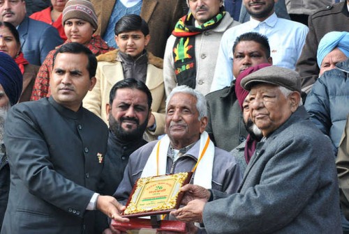 Punjab Cabinet Minister Bhagat Chunni Lal right honours a freedom fighter at Guru Gobind Singh Stadium in Jalandhar