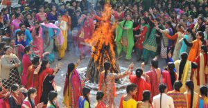 Students and staff of a school celebrate Lohri in Mohali on January 13