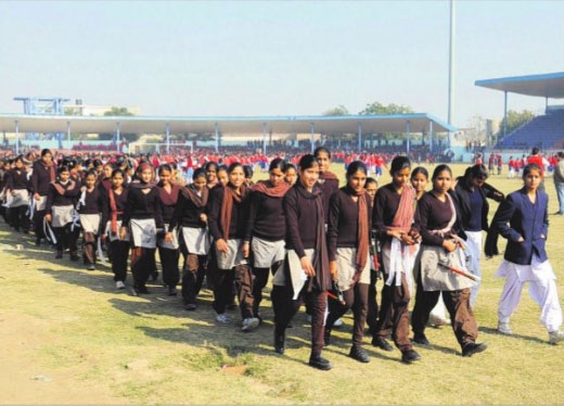 Students of various schools return after rehearsing for the Republic Day celebrations at the sports stadium in Bathinda
